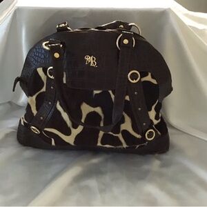 Stylist n versatile women bag featuring a chic black n brown design.